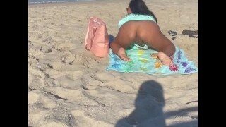 This naughty whore is a sucker for being the center of attention. This nasty babe shows off her beautiful pussy on the beach for everyone to see.