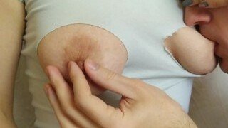 A woman gets her cute natural nipples sucked after a man ripped her T-shirt. A man enjoys playing with her woman's nipples by carefully and gently massaging them.